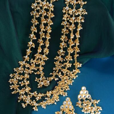 Gold Finish Kundan Necklace With White Stone