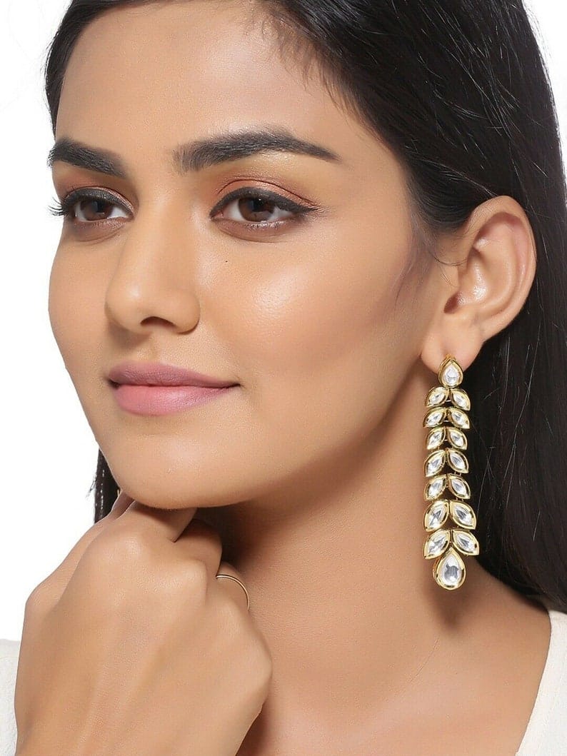 Gold Plated Kundan Floral And Leaf Carved Dangler Earrings - Image 2