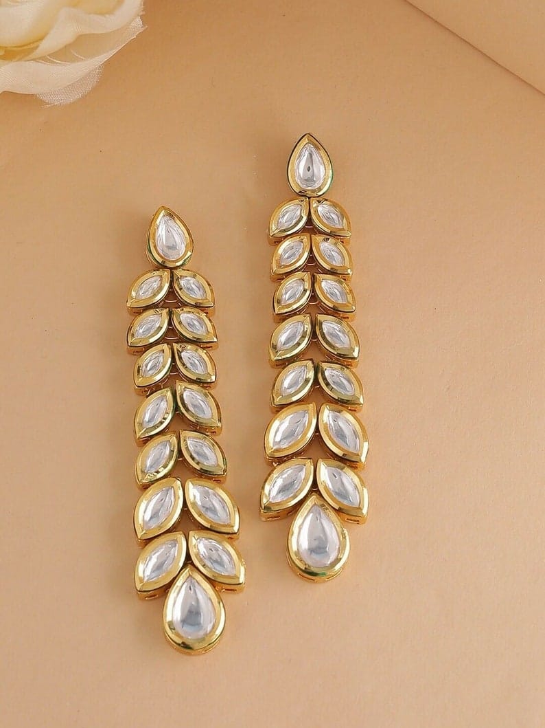 Gold Plated Kundan Floral And Leaf Carved Dangler Earrings