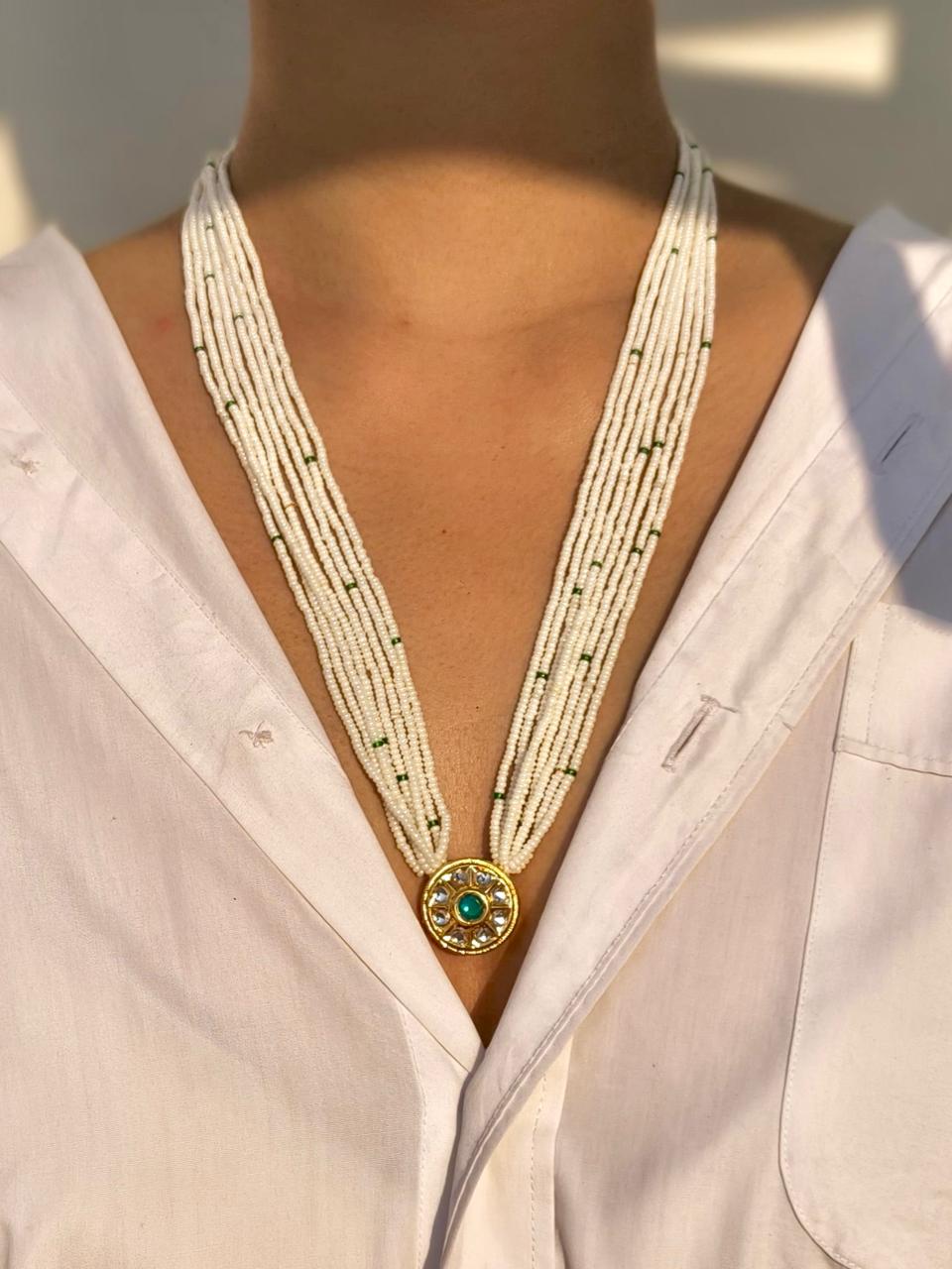 Multi-strand seed pearl necklace with round kundan pendant